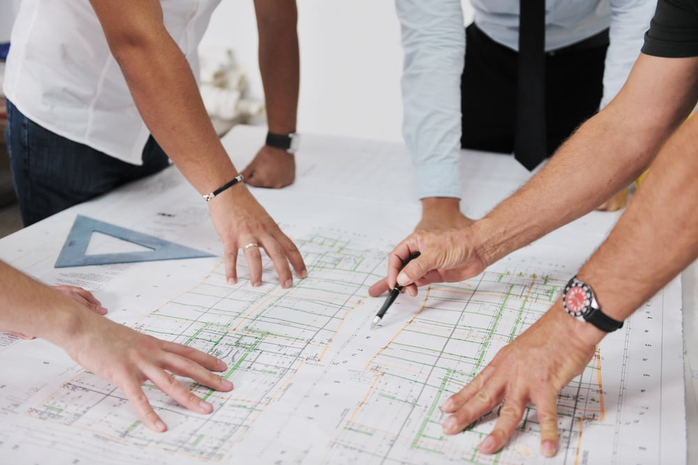 Team of architects people in group  on construciton site check documents and business workflow